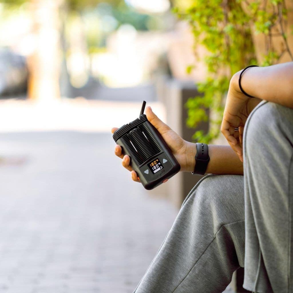 Individual enjoying the Storz & Bickel Mighty vaporizer